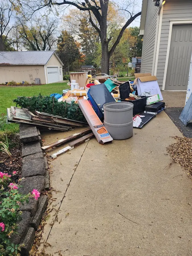 Dumpster being loaded with debris for Commercial Dumpster Rental in Upper Darby
